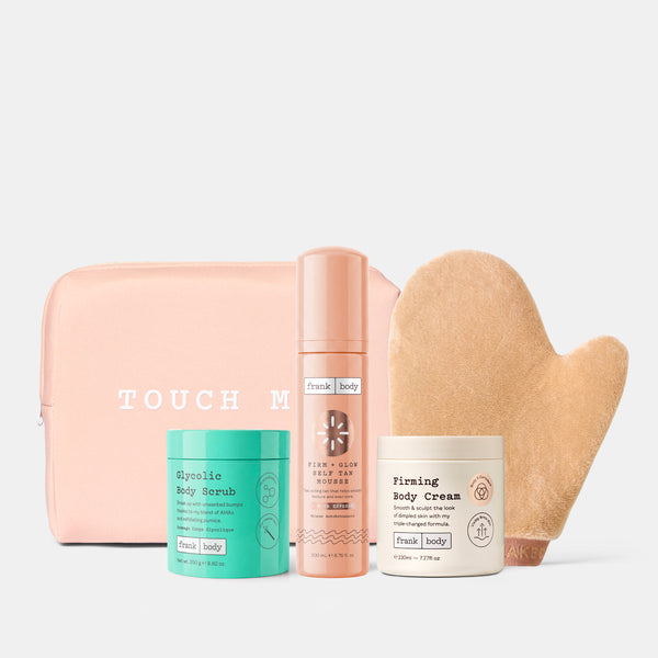 The frank body Everything Shower Kit: a pink pouch, Gentle Body Scrub, Self Tan Mousse, Firming Body Cream and tanning mitt.