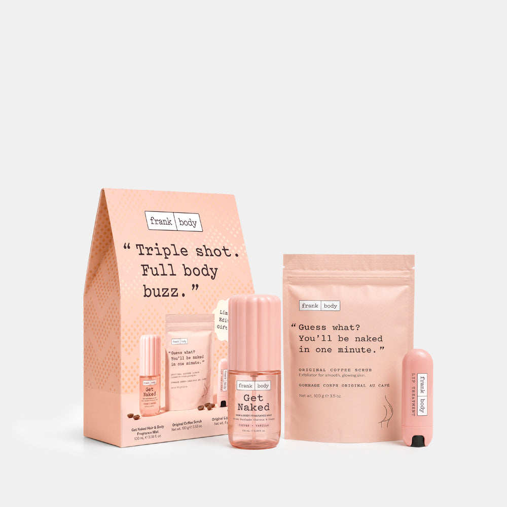 Fresh Body triple shot detox kit featuring a peach-colored paper bag, a bottle of Get Naked tea, a pouch of Natural Coffee Bean + Green Tea, and two small pink lip balm tubes on a light gray background.