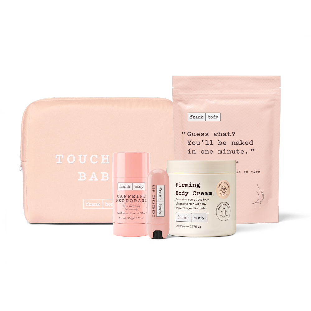 A pink and white Frank & body self-care gift set on a white background, including a blush pink zippered pouch, a pink deodorant stick, a pink travel size body wash tube, and a white body cream jar.
