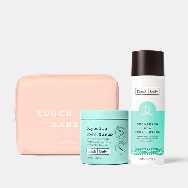 Acid Heroes Kit: a pink Touch Babe pouch with frank body Glycolic Body Scrub and Smoothing AHA Body Lotion.
